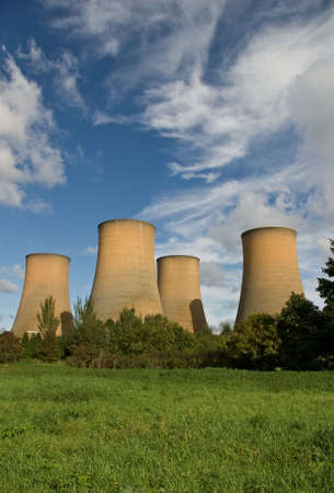 The cooling towers of a power station against a blue skyの写真素材