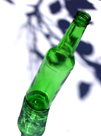 empty beer bottle on a white backgroundの写真素材