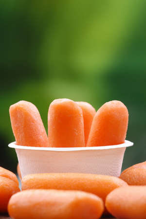 Organic peeled carrots in a recyclable bowl.の写真素材