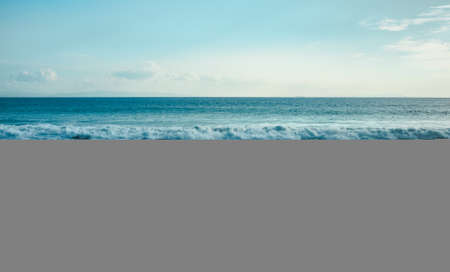 Sea, sand and blue sky. Sandy beach on the atlantic oceanの写真素材