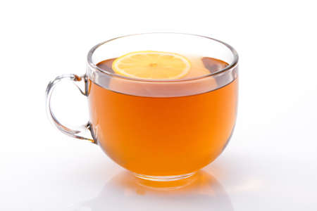 Glass cup of black tea with lemonの写真素材
