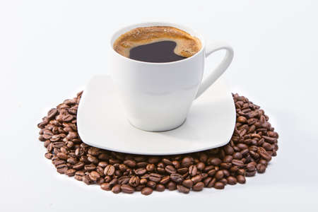 Coffee cup on coffee beansの写真素材