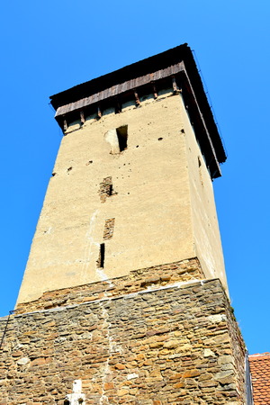 Tower.  Fortified medieval church in the village Malancrav, Transylvania. Here some of the most significant Gothic murals in Transylvania. The Saxon Romanesque Lutheran church has early 14th-century Gothic murals in the apse. 15th-century ones are found iのeditorial素材