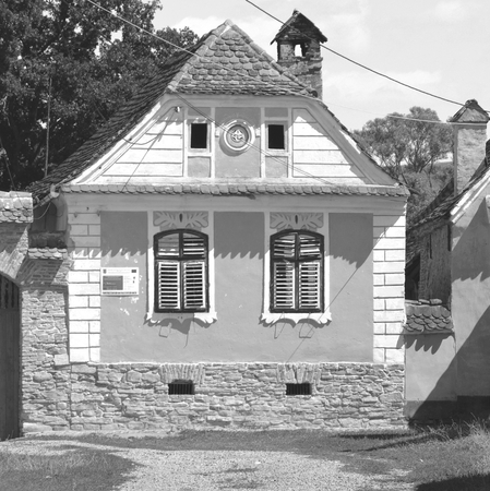 Black and White.Typical house in the village Crit-Kreutz, Transylvania. The villagers started building a single-nave Romanesque church, which is uncommon for a Saxon church, in the 13th century.の写真素材