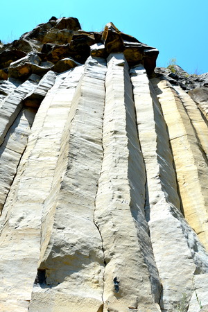 Basalt columns rocks in Racos, Transylvania Basalt Rocks are volcanic rock outcrops in the form of...