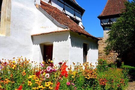 Fortified medieval saxon church in Cincsor-Kleinschenk, Sibiu county.  The church with a tower on the west is built in 1427. In the middle of the 15th century the first enclosure was erectedの写真素材