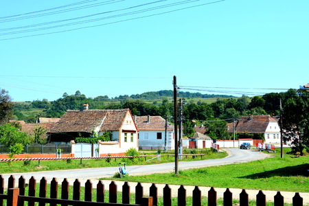 Typical rural landscape and peasant houses in  Bruiu - Braller, a commune in Sibiu County, Transylvania, Romania. The settlement was founded by the Saxon colonists in the middle of the 12th centuryの写真素材
