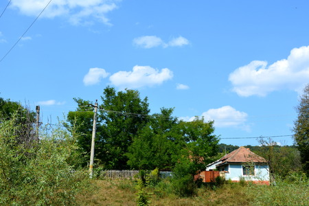 Typical rural landscape and peasant houses in  the village Felmer, Felmern, Transylvania, Romania. The settlement was founded by the Saxon colonists in the middle of the 12th centuryの写真素材