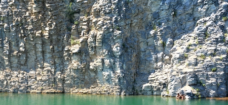 Emerald lake in an abandoned career. Racos is a village in Brasov county, Transylvania, Romania near one active and three abandoned stone career. It is a national protected areaの写真素材