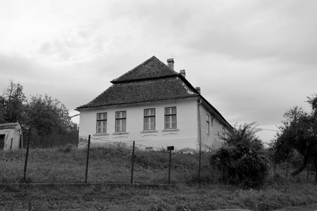 Typical rural landscape and peasant houses in Barcut, Bekokten, Brekolten, Transylvania, Romania. The settlement was founded by the Saxon colonists in the middle of the 12th centuryの写真素材