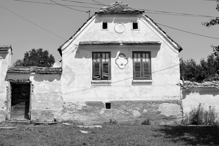 Typical rural landscape and peasant houses in  Bruiu - Braller, a commune in Sibiu County, Transylvania, Romania. The settlement was founded by the Saxon colonists in the middle of the 12th centuryの写真素材