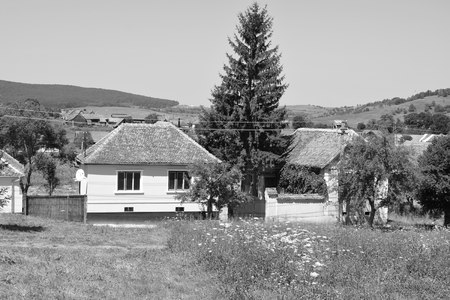 Typical rural landscape and peasant houses in the village Merghindeal- Mergenthal, Transylvania,Romania.の写真素材