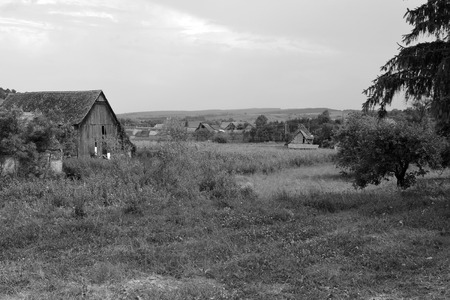 Typical rural landscape and peasant houses in Dealu Frumos, Schoenberg, a village in Merghindeal commune in Sibiu County, Transylvania, Romania.の写真素材