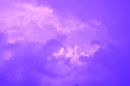 White clouds in a blue sky in a cloudy summer dayの写真素材