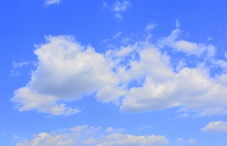 White clouds in a blue sky in a cloudy summer dayの写真素材