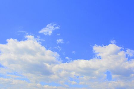 White clouds on blue sky in a cloudy summer dayの写真素材
