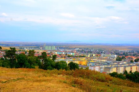 Codlea city. Typical landscape in the forests of Transylvania, Romania. Green landscape in the midsummer, in a sunny dayの写真素材
