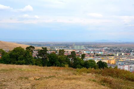 Codlea city. Typical landscape in the forests of Transylvania, Romania. Green landscape in the midsummer, in a sunny dayの写真素材