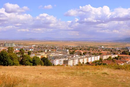 Codlea city. Typical landscape in the forests of Transylvania, Romania. Green landscape in the midsummer, in a sunny dayの写真素材