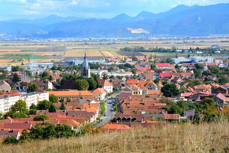 City Codlea. Typical landscape in the forests of Transylvania, Romania. Green landscape in the midsummer, in a sunny dayの写真素材