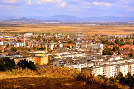 City Codlea. Typical landscape in the forests of Transylvania, Romania. Green landscape in the midsummer, in a sunny dayの写真素材