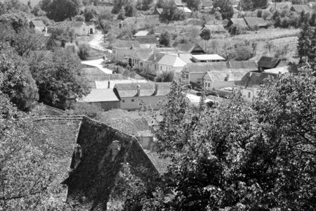 Typical rural landscape and peasant houses in  the village Alma Vii (Almen) Transylvania, Romania. The settlement was founded by the Saxon colonists in the middle of the 12th centuryのeditorial素材