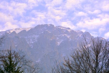Piatra Craiului in Carpathian Mountains, Transylvania. Typical landscape in the forests of  Romania. Green landscape in spring, in a sunny dayの写真素材