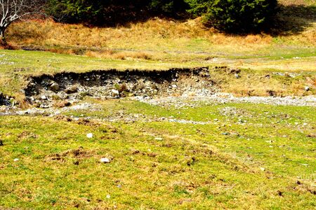 Piatra Craiului in Carpathian Mountains, Transylvania. Typical landscape in the forests of  Romania. Green landscape in spring, in a sunny dayの写真素材