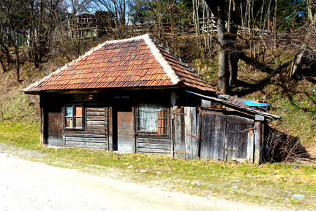 Chalet. Piatra Craiului in Carpathian Mountains, Transylvania. Typical landscape in the forests of  Romania. Green landscape in spring, in a sunny dayのeditorial素材