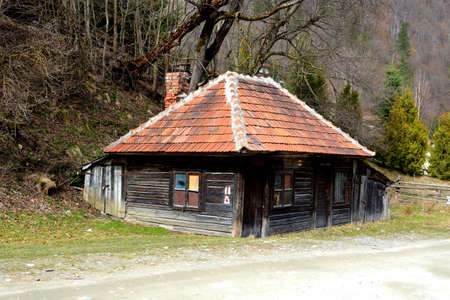 Chalet in Piatra Craiului in Carpathian Mountains, Transylvania. Typical landscape in the forests of  Romania. Green landscape in spring, in a sunny dayのeditorial素材