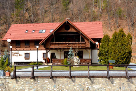 Chalet in Piatra Craiului in Carpathian Mountains, Transylvania. Typical landscape in the forests of  Romania. Green landscape in spring, in a sunny dayのeditorial素材