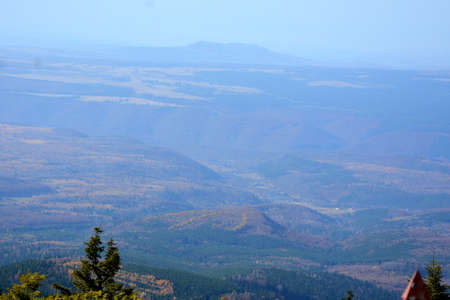 View from the top of the mountain to the valley and the forestの写真素材