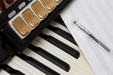 Keys of the Accordion and the book of music with the pen の写真素材