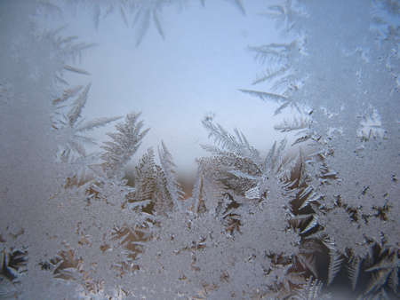 This is frosty pattern on glass winter windowの写真素材