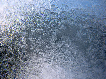 This is frosty pattern on glass winter windowの写真素材