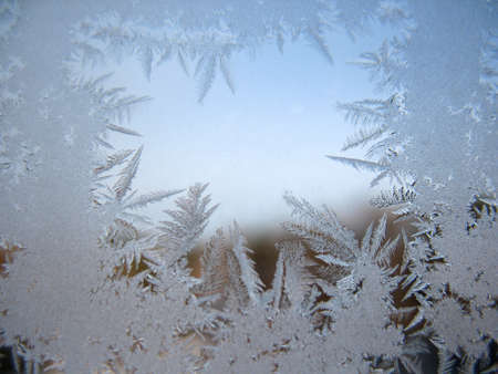 This is frosty pattern on glass winter windowの写真素材