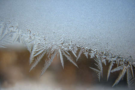 This is frosty pattern on glass winter windowの写真素材