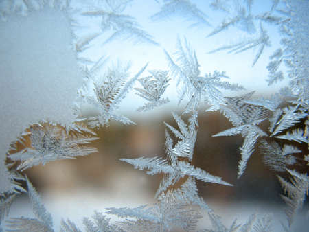 This is frosty natural pattern on glass winter windowの写真素材