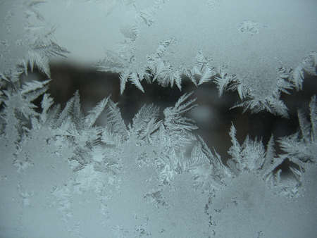 This is frosty pattern on glass winter windowの写真素材