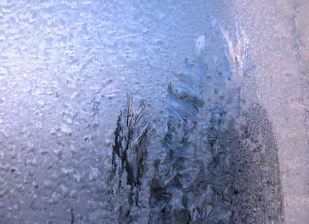 frosty pattern on glass winter window