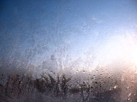 This is frosty pattern on glass winter windowの写真素材