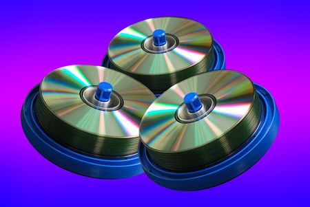CD and DVD discs,  isolated on color backgroundの写真素材