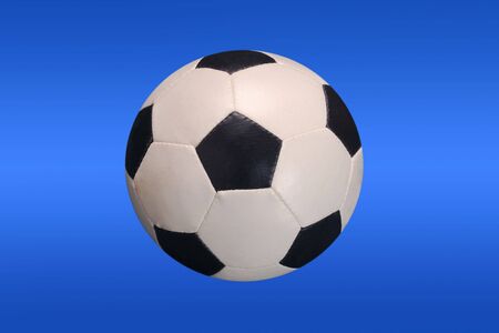 soccer ball isolated on blue - path includedの写真素材