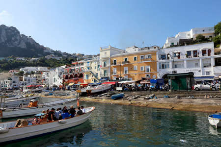 view of boat harbor or Marina Grande, on the Island of Capri, with colorful buildings , a major tourist destination near Naples and Sorrento on the Tyrrhenian Sea, Bay (Gulf) of Naples.のeditorial素材