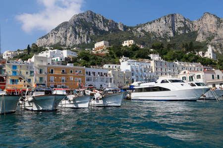 view of boat harbor or Marina Grande, on the Island of Capri, with colorful buildings , a major tourist destination near Naples and Sorrento on the Tyrrhenian Sea, Bay (Gulf) of Naples.のeditorial素材