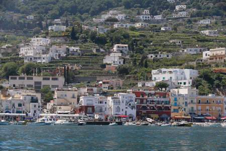 view of boat harbor or Marina Grande, on the Island of Capri, with buildings , a major tourist destination near Naples and Sorrento on the Tyrrhenian Sea, Bay (Gulf) of Naples.のeditorial素材