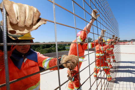 SUZANO, SP, BRAZIL - SEPTEMBER, 13, 2013 - operatives works in construction  of road on countryside...