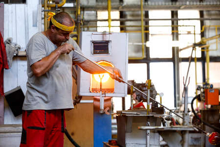 KARLOVY VARY, CZECH REPUBLIC - JUNE 01, 2017 - Glass blowers demonstrate their craft, a popular tourist attraction in Bohemia regionのeditorial素材