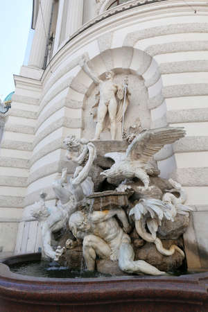 The forces on land fountain in Vienna Hofburg Imperial Palace at day, Austriaのeditorial素材