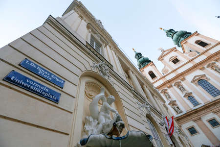 Facade of Jesuit Church or University Church on Dr Ignaz Seipel Platz in Vienna, Austriaのeditorial素材